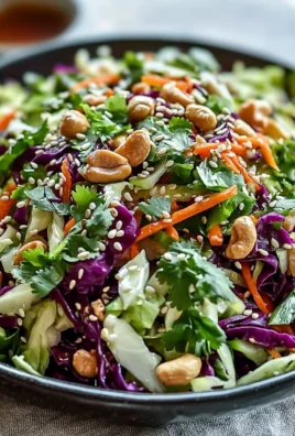 Bowl of colorful Asian Cabbage Salad with fresh vegetables and sesame dressing