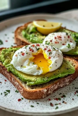 Avocado toast topped with a poached egg served on a wooden cutting board.