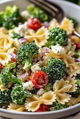 Delicious bowl of best broccoli pasta salad with veggies and dressing