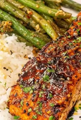 Delicious Cajun Honey Butter Salmon topped with sweet and spicy glaze.