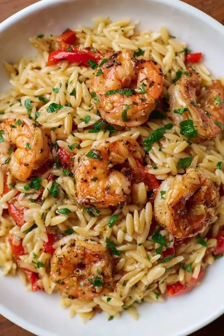 Cajun Shrimp Orzo with roasted peppers and Parmesan in a bowl