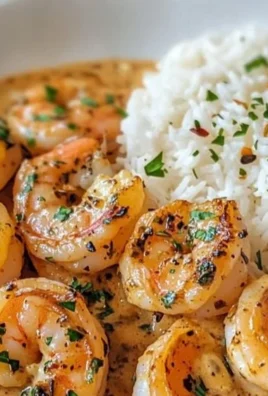 Easy creamy garlic shrimp served with pasta in a white bowl