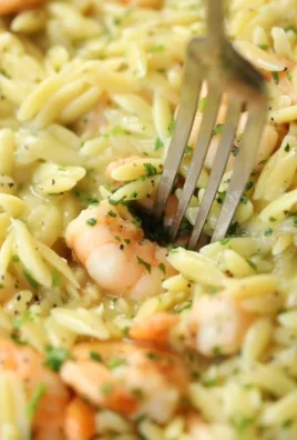Delicious bowl of Garlic Butter Orzo with Prawns topped with herbs