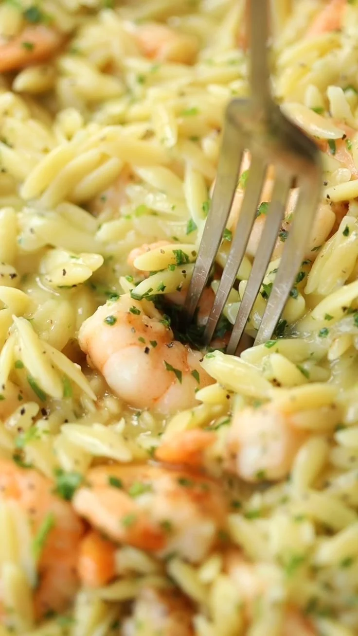 Delicious bowl of Garlic Butter Orzo with Prawns topped with herbs