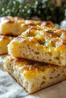 Freshly baked gluten-free focaccia bread topped with herbs and olive oil
