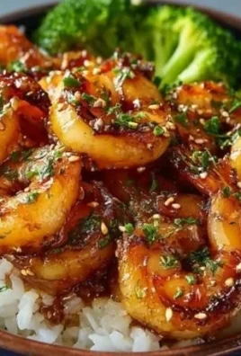 Honey Garlic Shrimp Bowls with vegetables and rice on a rustic table
