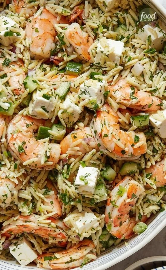 A vibrant plate of Ina's roasted shrimp and orzo, showcasing juicy shrimp and flavorful pasta.
