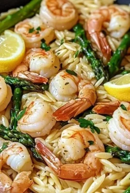 Lemon Garlic Shrimp and Asparagus Orzo dish served in a bowl with fresh ingredients