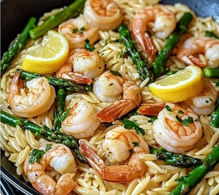 Lemon Garlic Shrimp and Asparagus Orzo dish served in a bowl with fresh ingredients