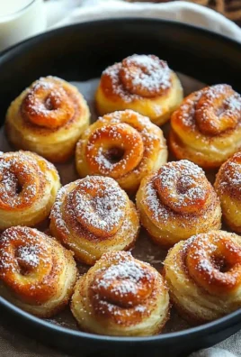 Delicious mini cinnamon roll bites with icing on a decorative plate