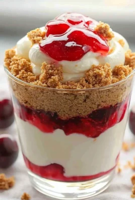 Delicious no-bake cheesecake parfait layered with berries and toppings.