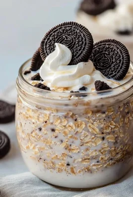Delicious OREO overnight oats served in a glass with chocolate and cookie toppings.