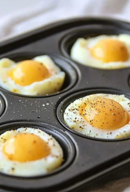 Oven baked eggs in a muffin tin, fresh and ready to serve for breakfast.