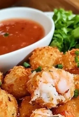 Homemade shrimp balls arranged on a platter, ready to serve.