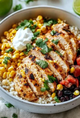 Delicious Street Corn Chicken Rice Bowl topped with fresh corn and spices