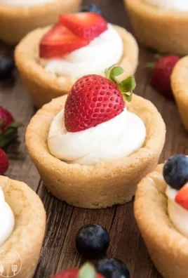 Delicious cheesecake sugar cookie cups displayed on a serving plate.