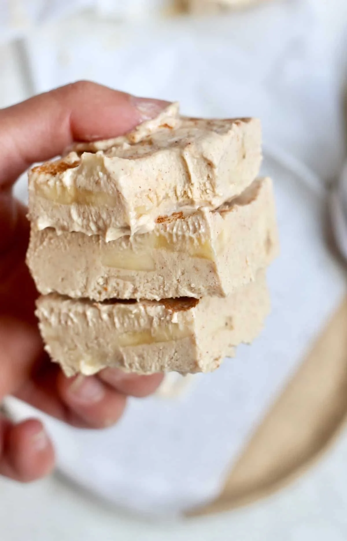 Creamy peanut butter banana frozen yogurt bars topped with sliced bananas