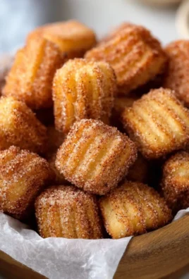 Delicious and easy baked churro bites rolled in cinnamon sugar