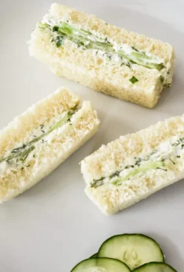 Delicious English tea cucumber sandwiches served on a plate.