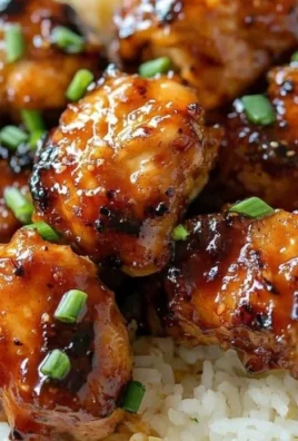 Delicious Firecracker Chicken garnished with green onions and sesame seeds