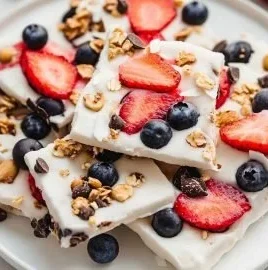 Delicious frozen yogurt bark topped with fruits and nuts