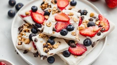 Delicious frozen yogurt bark topped with fruits and nuts