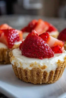 No-bake mini cheesecake cups topped with fruits and whipped cream