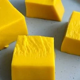 Delicious mango pudding served in a bowl with fresh mango slices on top