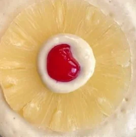 Fluffy Pineapple Upside Down Pancakes topped with caramelized pineapple slices.