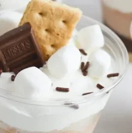 Delicious S'mores pudding parfaits with chocolate, marshmallows, and graham crackers.