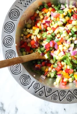 Colorful Spring Chopped Salad with fresh vegetables and herbs