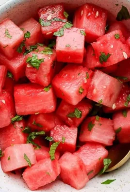 Colorful Watermelon Mint Salad with fresh mint leaves and juicy watermelon cubes