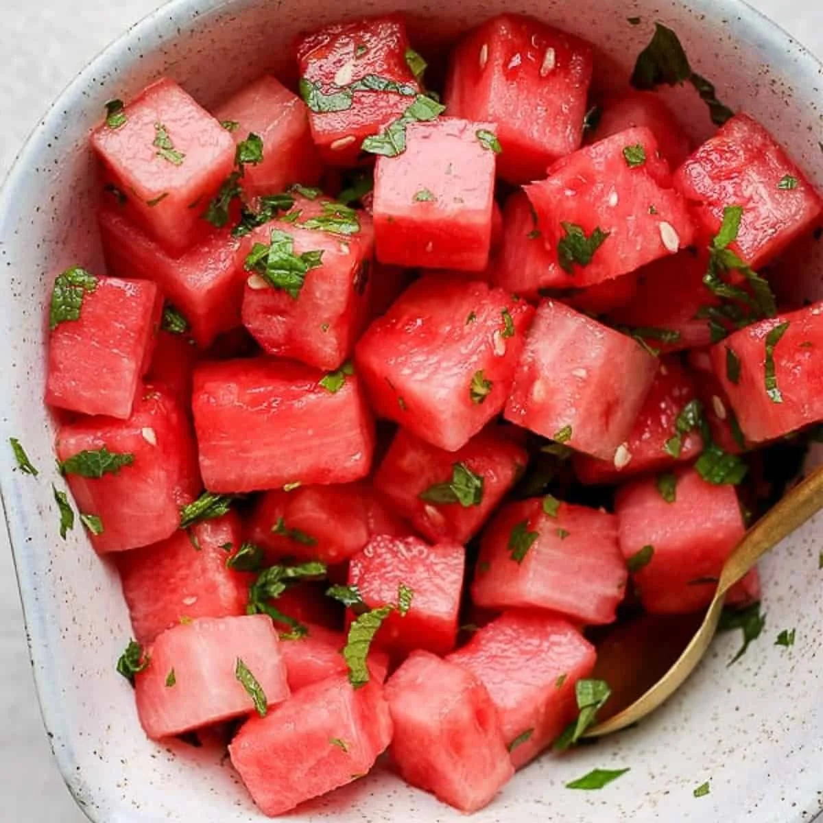 Colorful Watermelon Mint Salad with fresh mint leaves and juicy watermelon cubes
