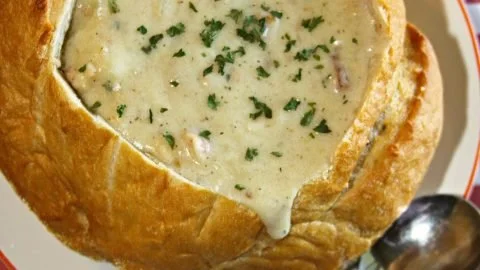 Bowl of Chunky New England Clam Chowder with fresh clams and herbs