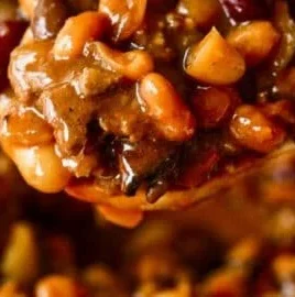 Delicious Cowboy Baked Beans served in a bowl, showcasing hearty ingredients.