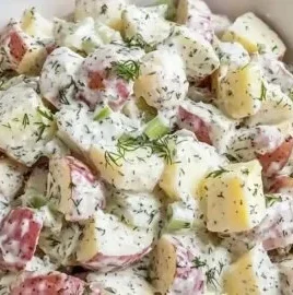 Creamy red potato salad in a bowl, perfect for summer gatherings