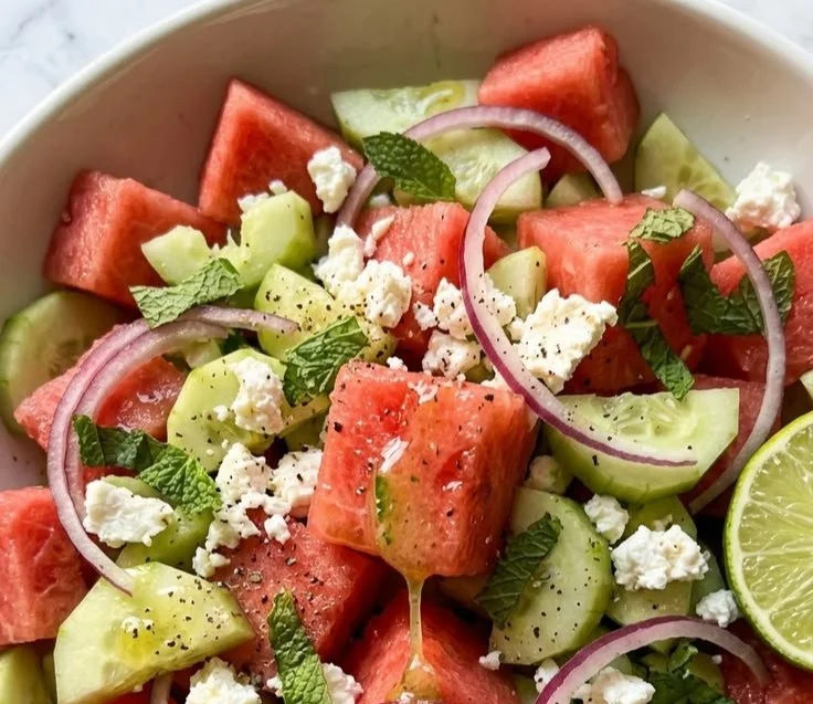 Cucumber watermelon salad with lime vinaigrette in a bowl