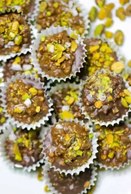 Dubai chocolate pistachio cups showcasing rich chocolate and pistachio layers.