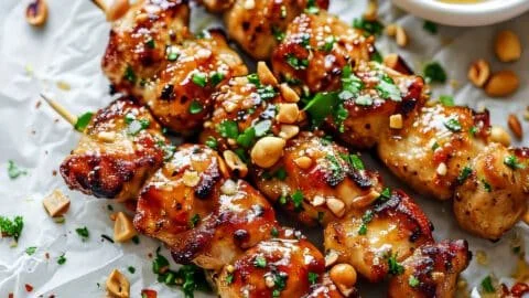 Easy grilled chicken skewers with honey garlic sauce on a plate.