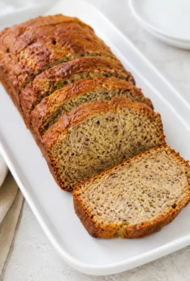 Slices of Greek Yogurt Banana Bread on a wooden board