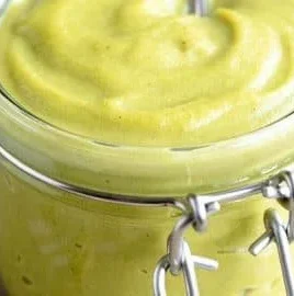 A bowl of creamy Italian Pistachio Cream ready to be used in desserts.
