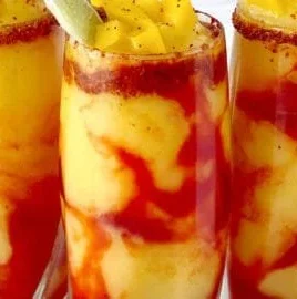 Delicious homemade Mangonada served in a cup with mango and chili