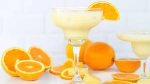 Refreshing Orange, Pineapple & Coconut Mocktail served in a glass