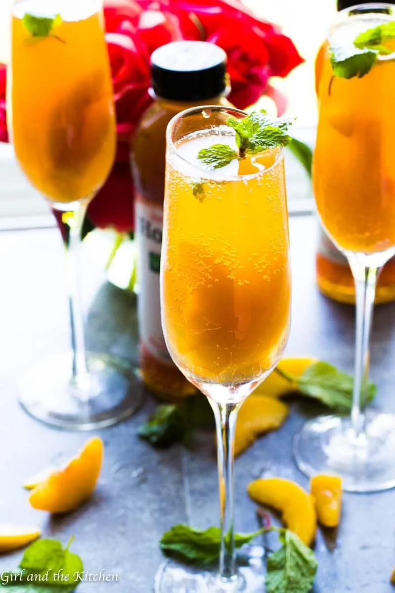 Sparkling Bellini Mocktail served in a glass with fresh fruit garnish