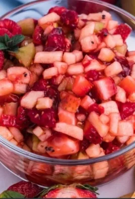 Sweet fruit salad with cinnamon sugar tortilla chips served in a bowl.