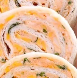 Delicious taco roll ups served on a platter, perfect for snacks and parties.