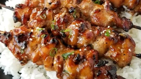 Grilled Teriyaki Chicken Skewers served on a platter with veggies