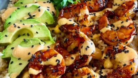 Delicious teriyaki shrimp rice bowl with vibrant vegetables and savory sauce