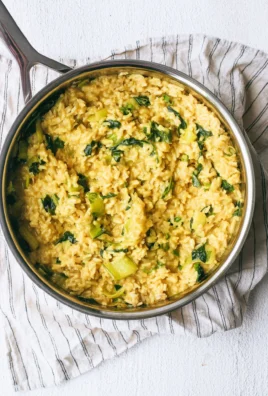 Bowl of anti-inflammatory creamy coconut rice garnished with herbs