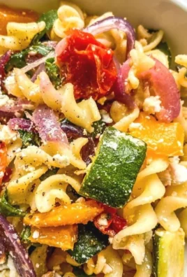 Baked feta pasta served with fresh basil and cherry tomatoes